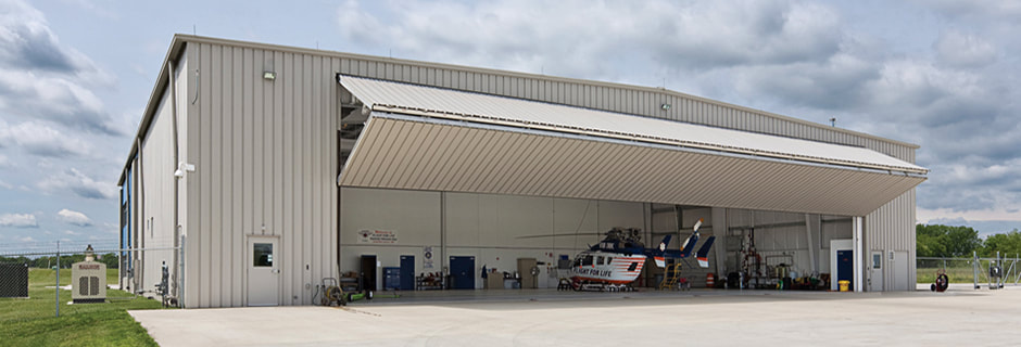 Privat plane in frontof hangar