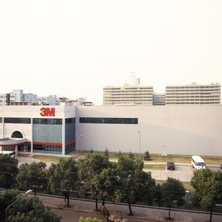 A Huge White Building With 3M in Red