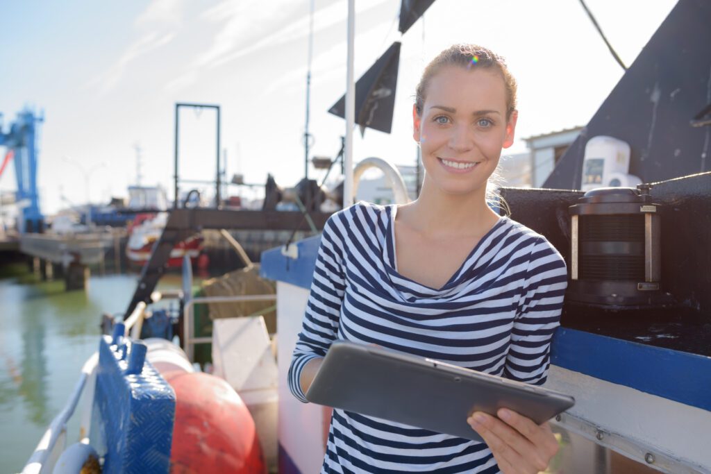 female holding a checklist in front of the port