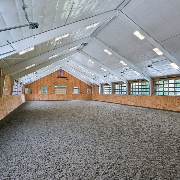 The Inside of a Warehouse With Gravel Pathway