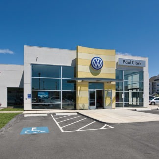 Paul clark building beside a Volkswagen showroom