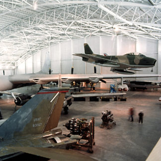 A Hangar With Military Plaines Parked