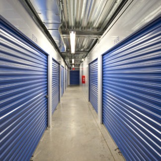 Varsity self storage with blue shutters