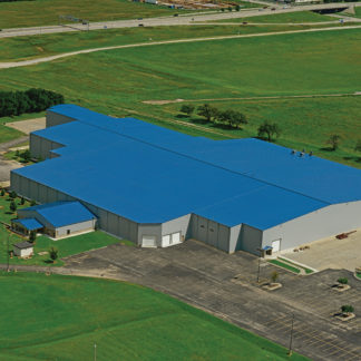 An aerial view of a big blue building