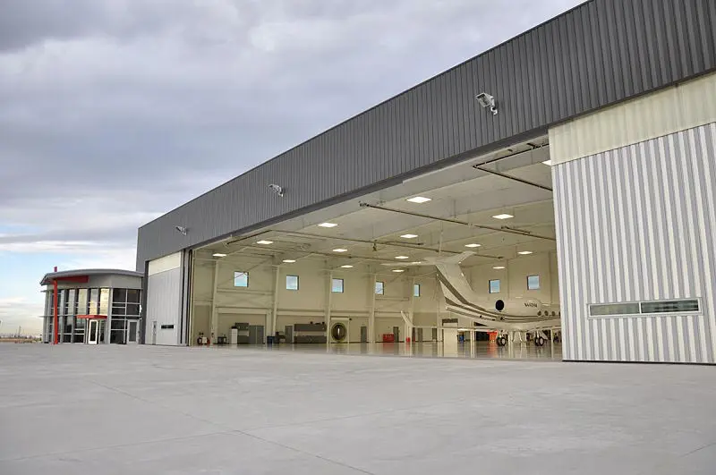 A Metallic Warehouse With an Open Entrance for Airplanes